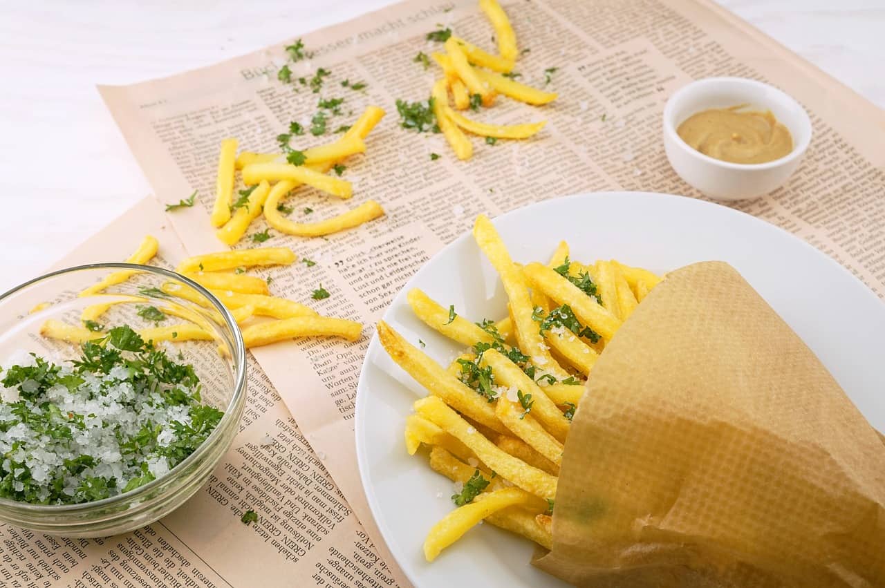 A pack of french fries scattered on the floor. Can rabbits eat french fries