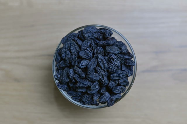 A bowl of black raisins