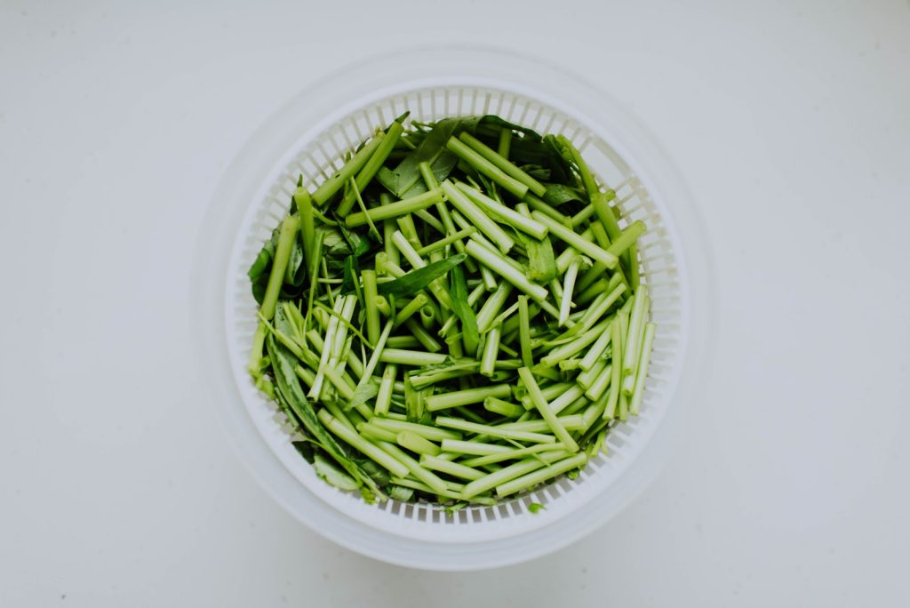A bowl of chopped green onions