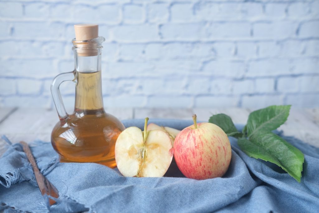 A clear bottle with apple cider vinegar